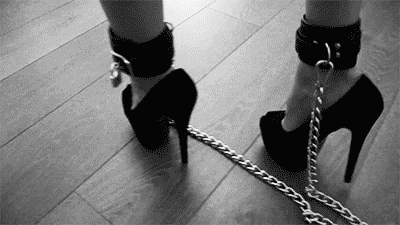 slave girls legs tied with a chain