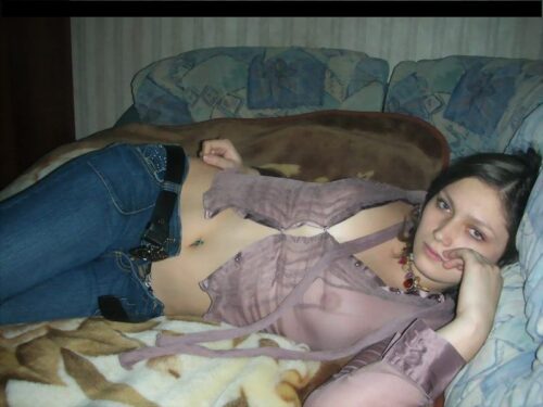 girl dressed in jeans and seethrough shirt
